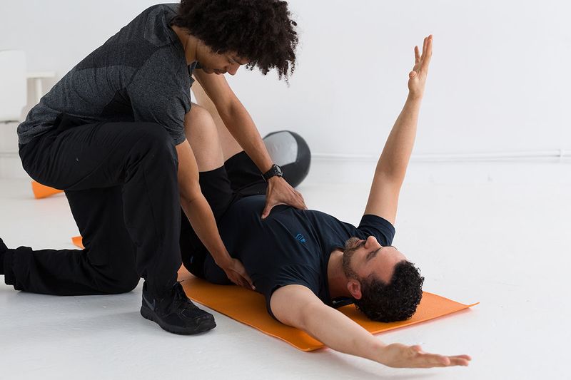 Ben Blake Davies providing hands-on rehabilitation coaching